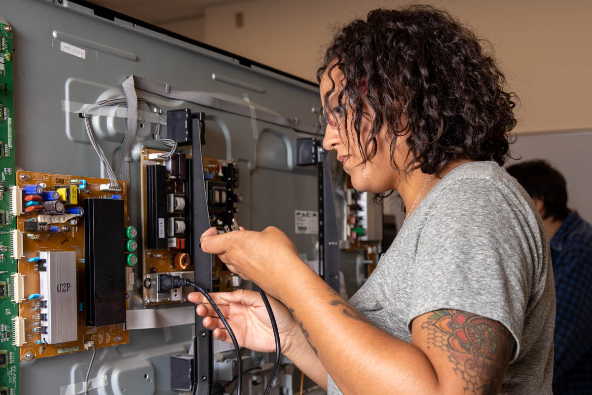 Woman working on server